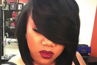 Bobcut with deep side part and bold red lipstick